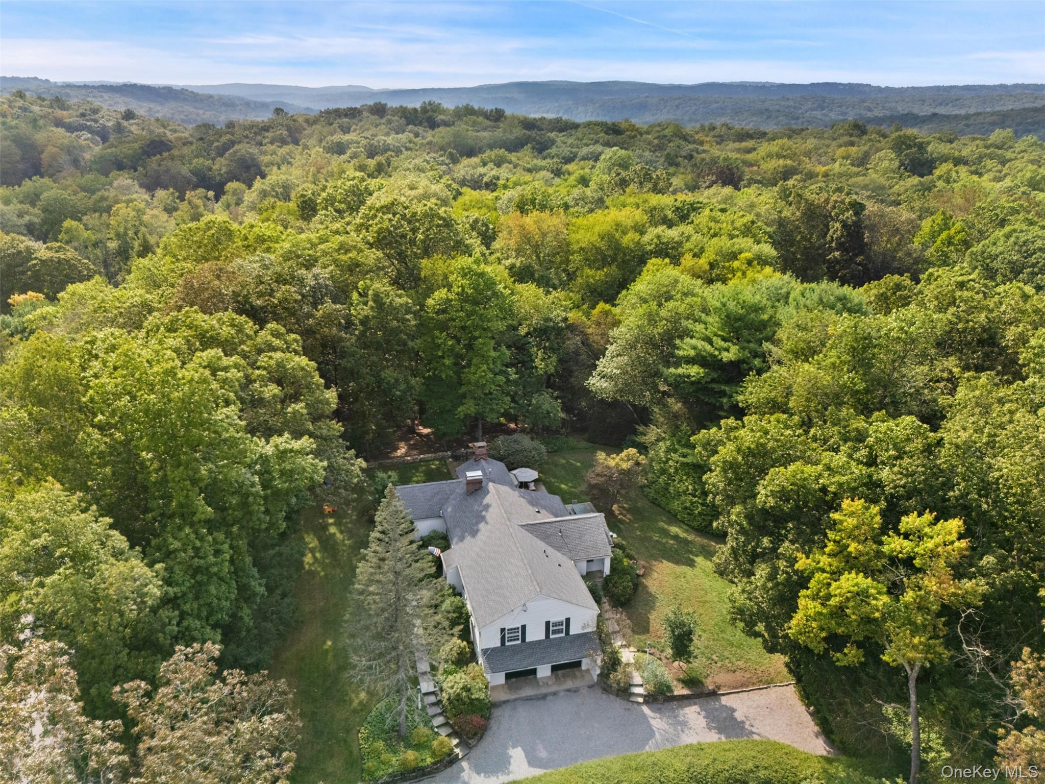 43 Croton Lake Road Katonah, NY 10536 - Photo 26 of 26 an aerial view of a house with a yard