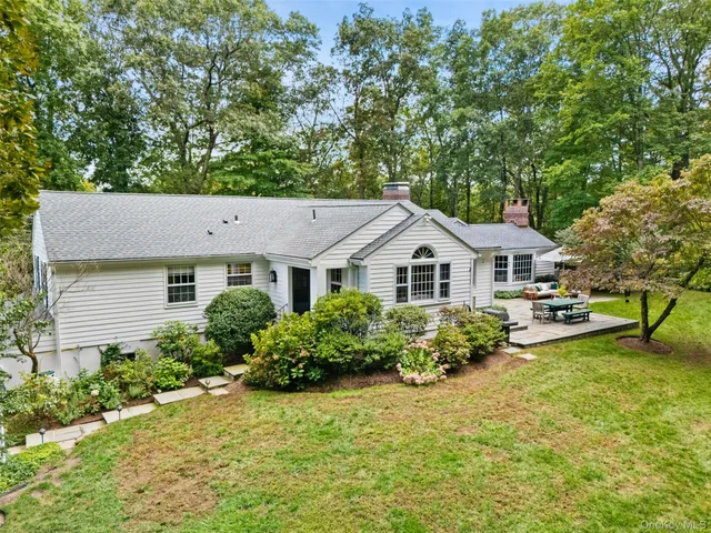 a aerial view of a house with swimming pool and porch