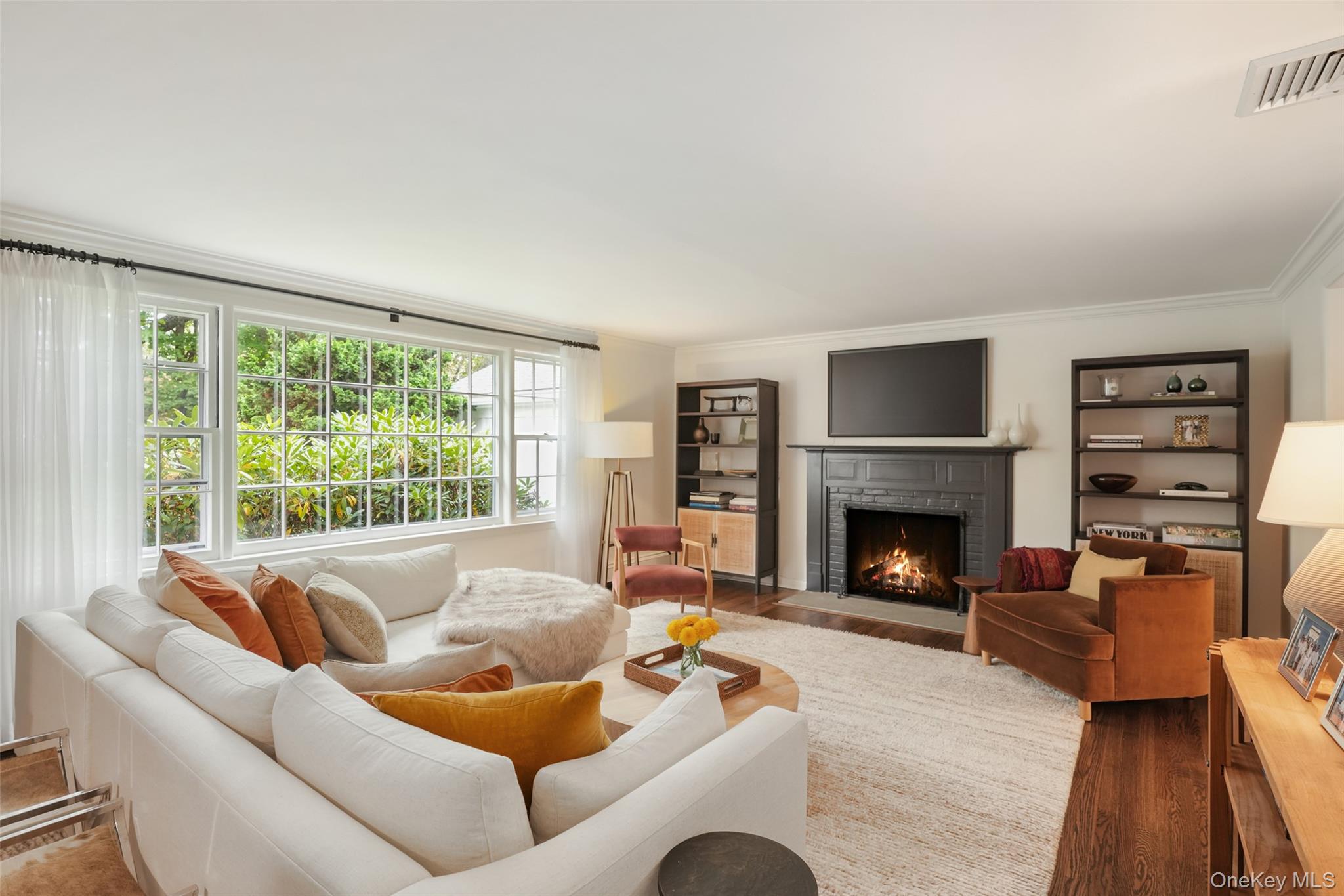 43 Croton Lake Road Katonah, NY 10536 - Photo 4 of 26 a living room with furniture and a fireplace