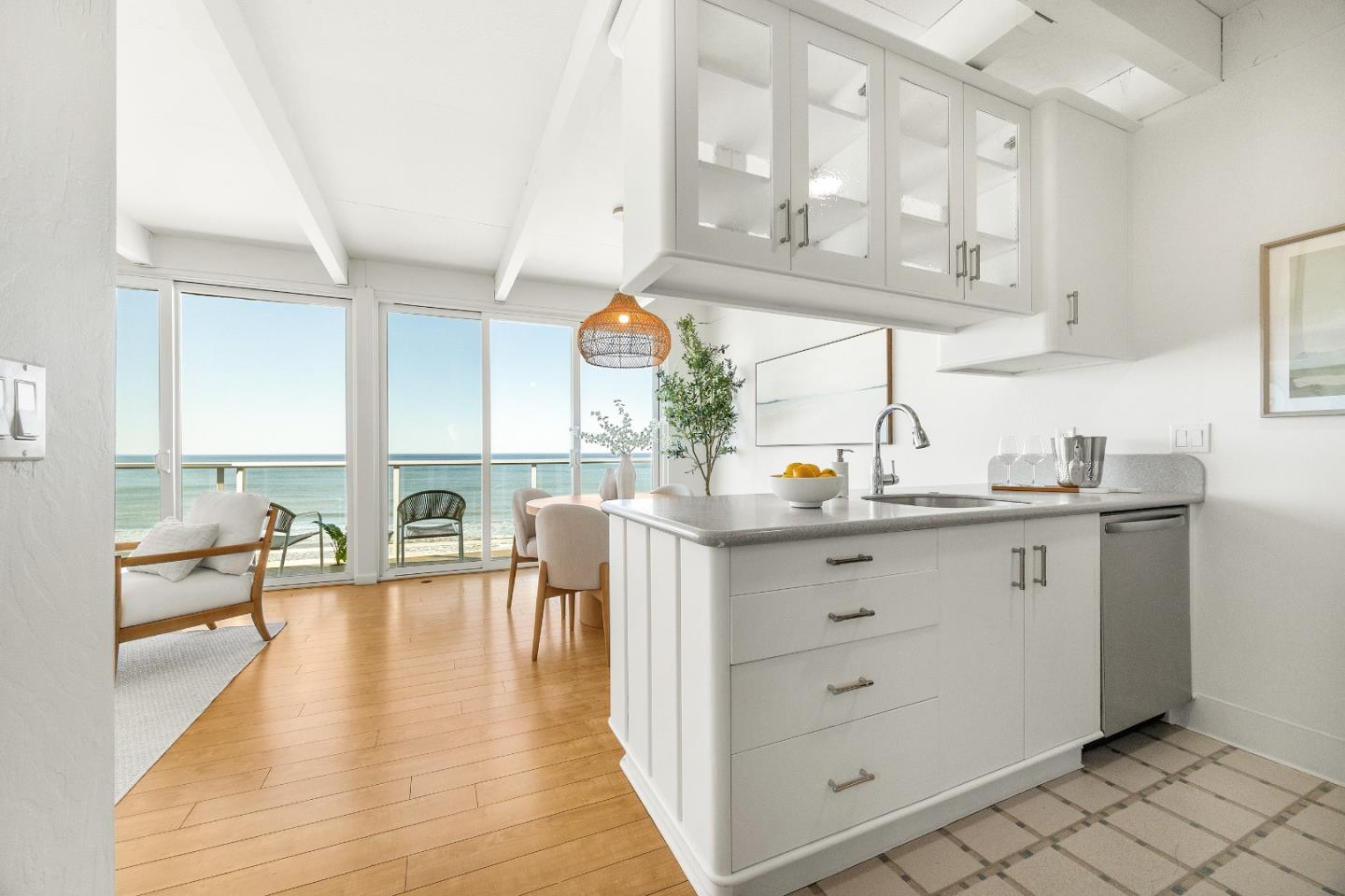 230 Rio Del Mar Boulevard, Unit K Aptos, CA 95003 - Photo 5 of 29 a kitchen with white cabinets and wooden floor