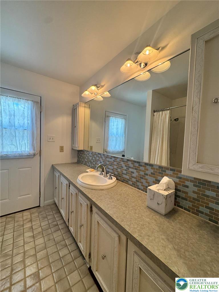 2667 Washington Lane Bethlehem, PA 18015 - Photo 38 of 59 a bathroom with a sink a vanity and a mirror