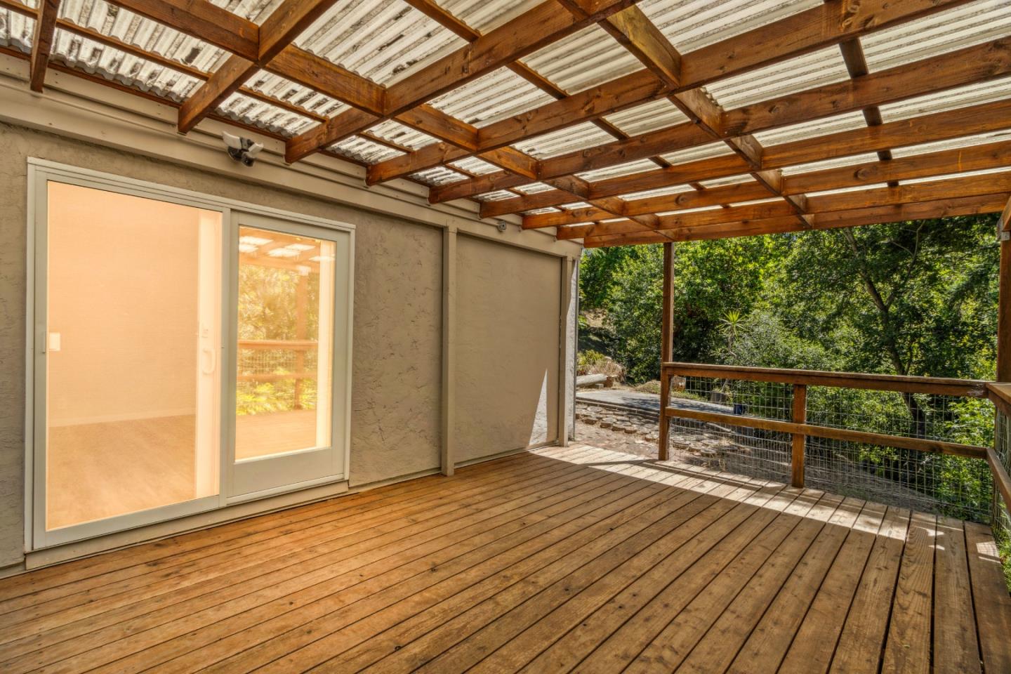 24895 Skyland Road Los Gatos, CA 95033 - Photo 87 of 113 a view of a room with wooden floor and iron stairs