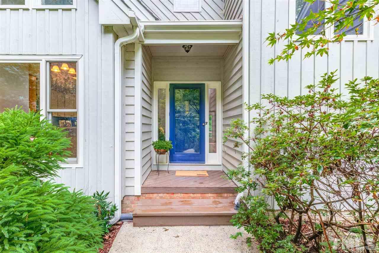 7604 Glenharden Drive Raleigh, NC 27613 - Photo 3 of 30 a front view of a house with a garden