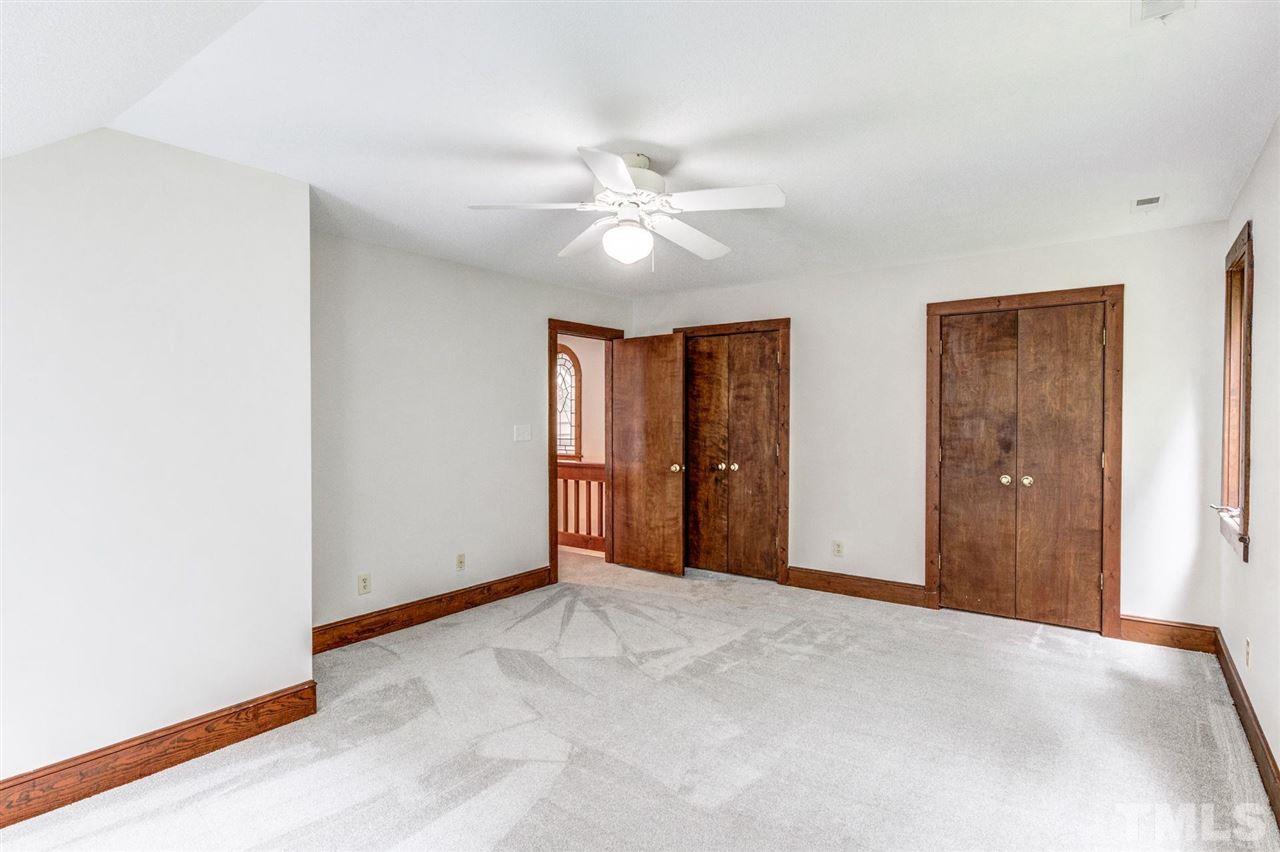7604 Glenharden Drive Raleigh, NC 27613 - Photo 23 of 30 a view of an empty room with window and chandelier fan