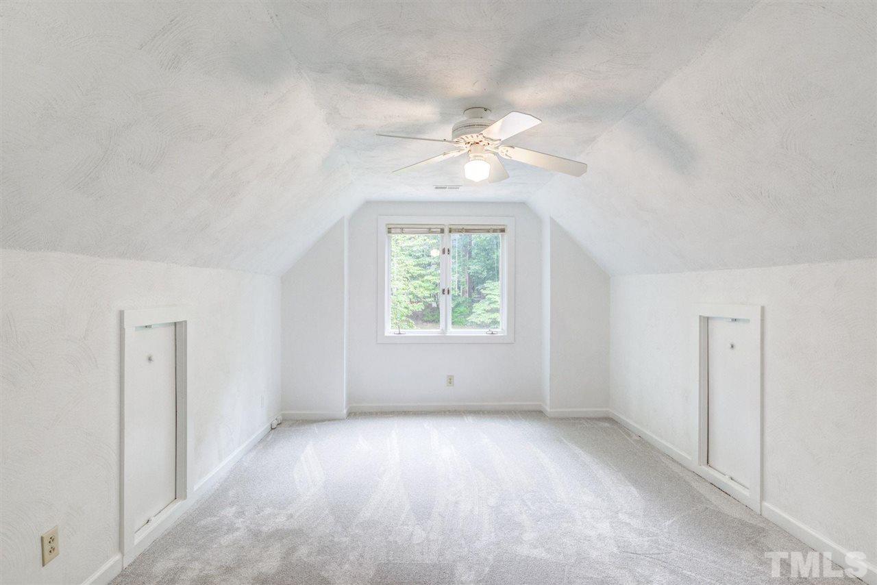 7604 Glenharden Drive Raleigh, NC 27613 - Photo 26 of 30 an empty room with windows and ceiling fan