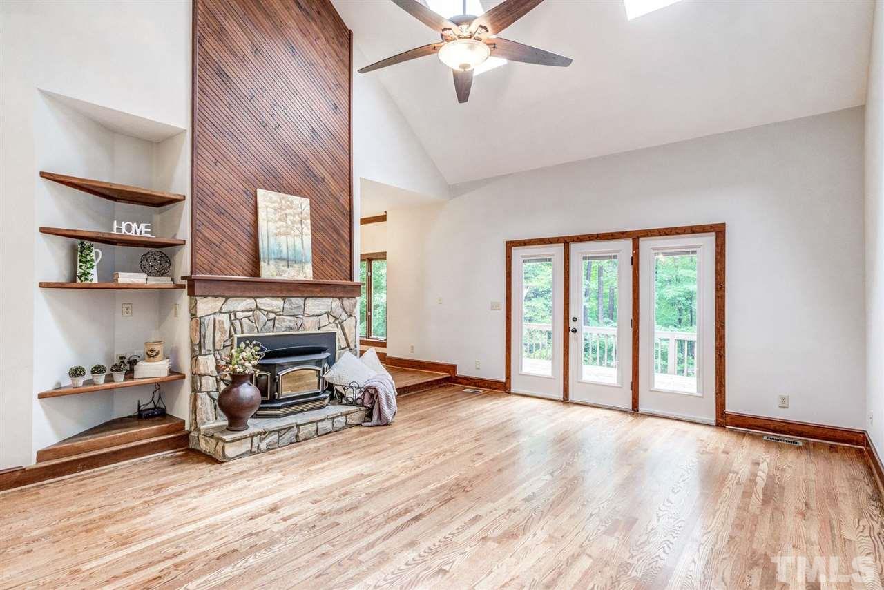 7604 Glenharden Drive Raleigh, NC 27613 - Photo 5 of 30 a view of livingroom with furniture and a fireplace