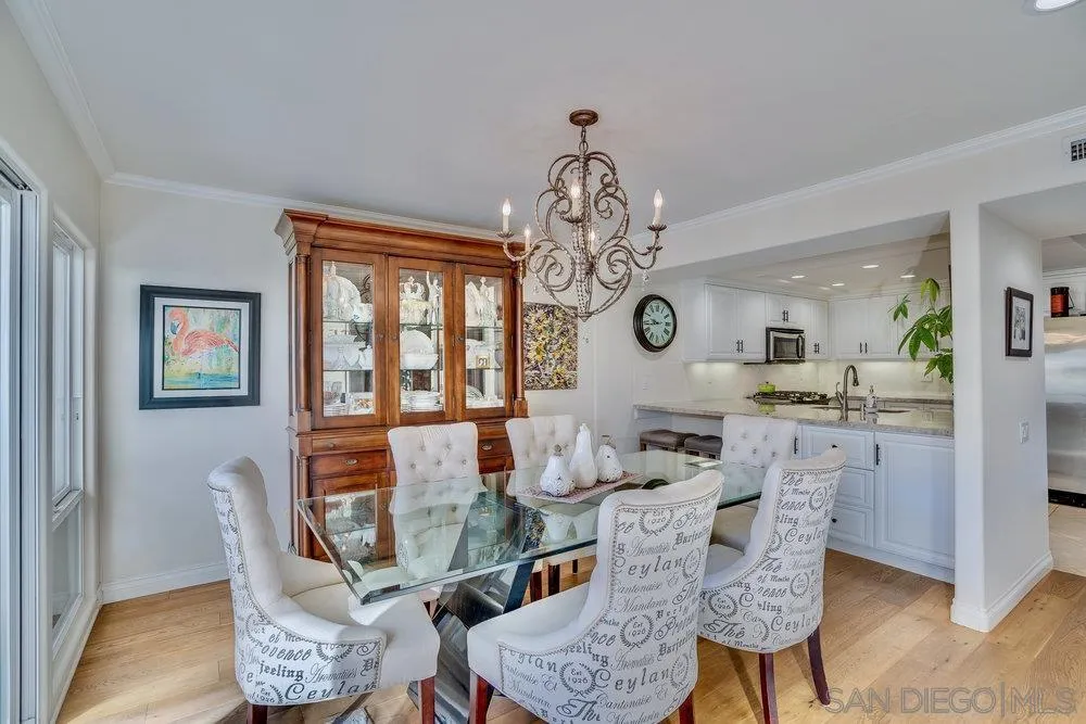 4 GingerTree Lane Coronado, CA 92118 - Photo 15 of 54 a dining room with furniture a chandelier and window