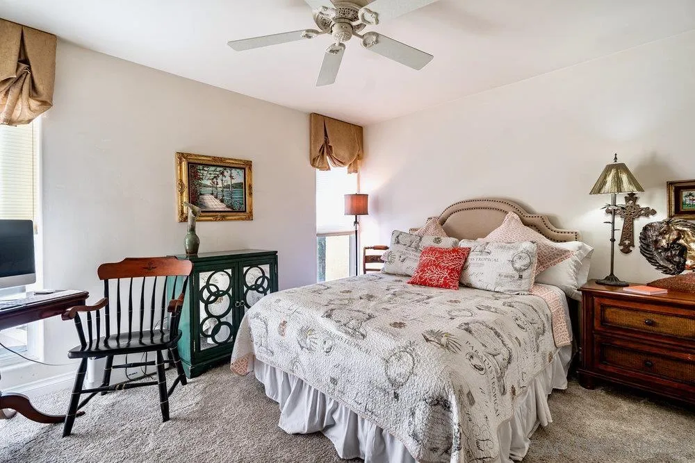 4 GingerTree Lane Coronado, CA 92118 - Photo 28 of 54 a bedroom with a bed and a chandelier
