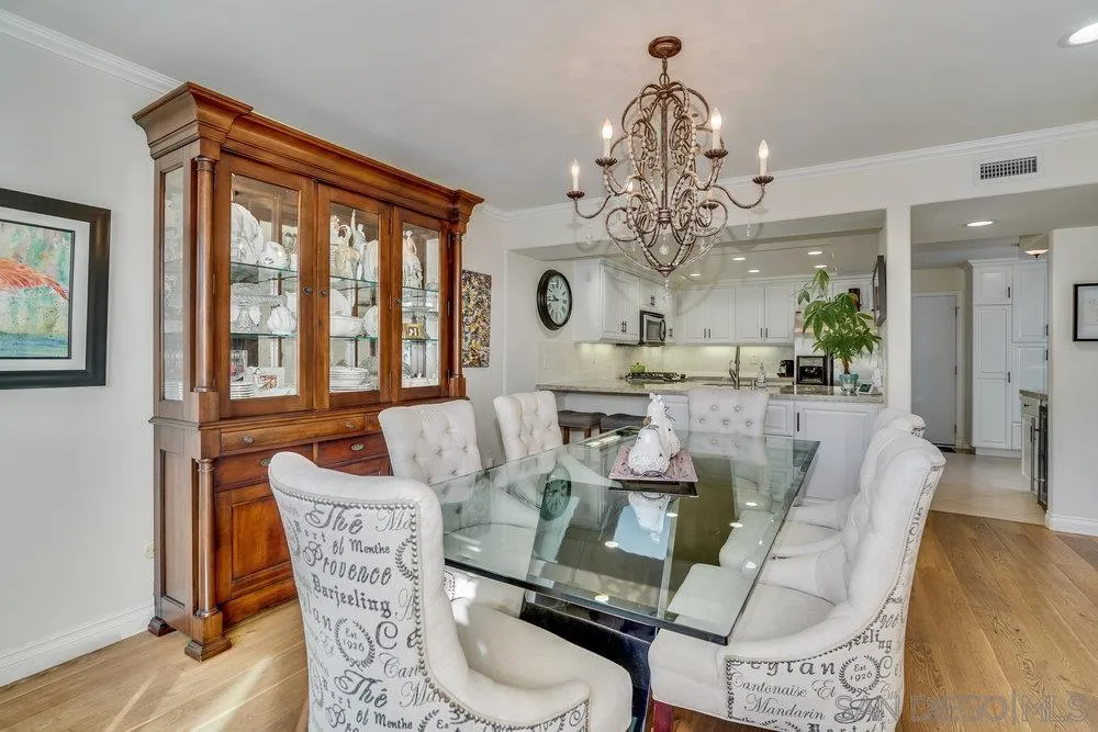 4 GingerTree Lane Coronado, CA 92118 - Photo 39 of 54 a view of a dining room with furniture a chandelier and wooden floor