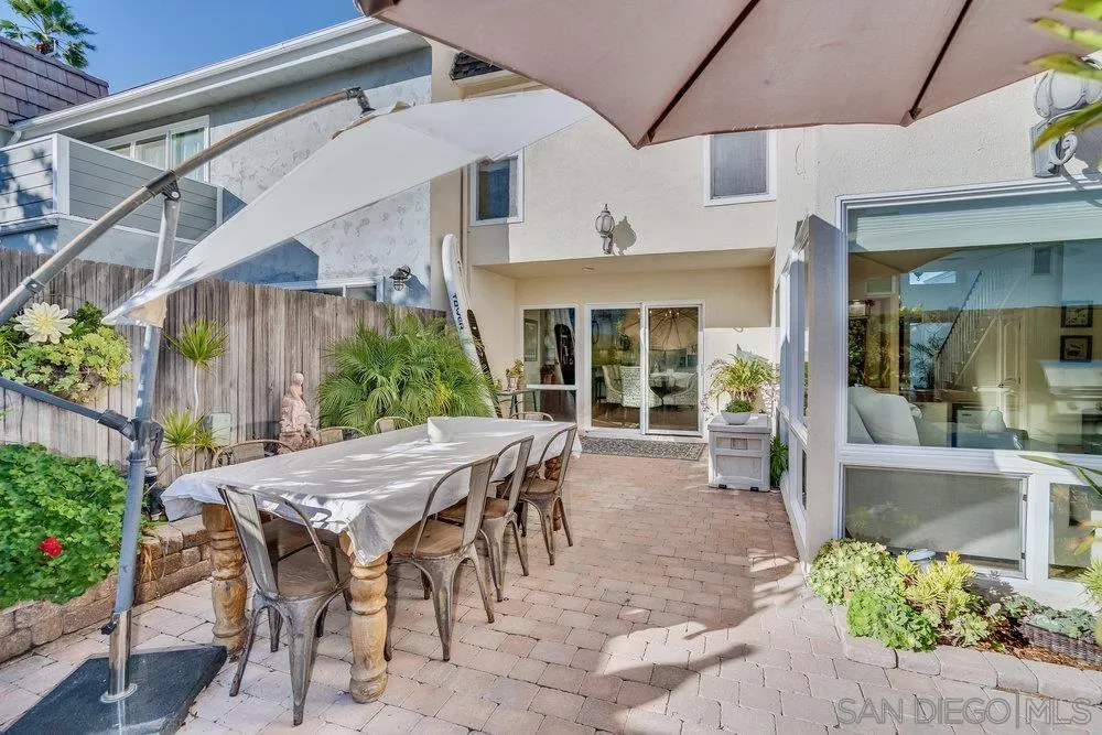4 GingerTree Lane Coronado, CA 92118 - Photo 42 of 54 a view of a patio with table and chairs and potted plants
