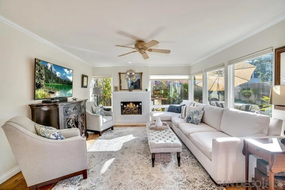 4 GingerTree Lane Coronado, CA 92118 - Photo 5 of 54 a living room with furniture a fireplace and a flat screen tv