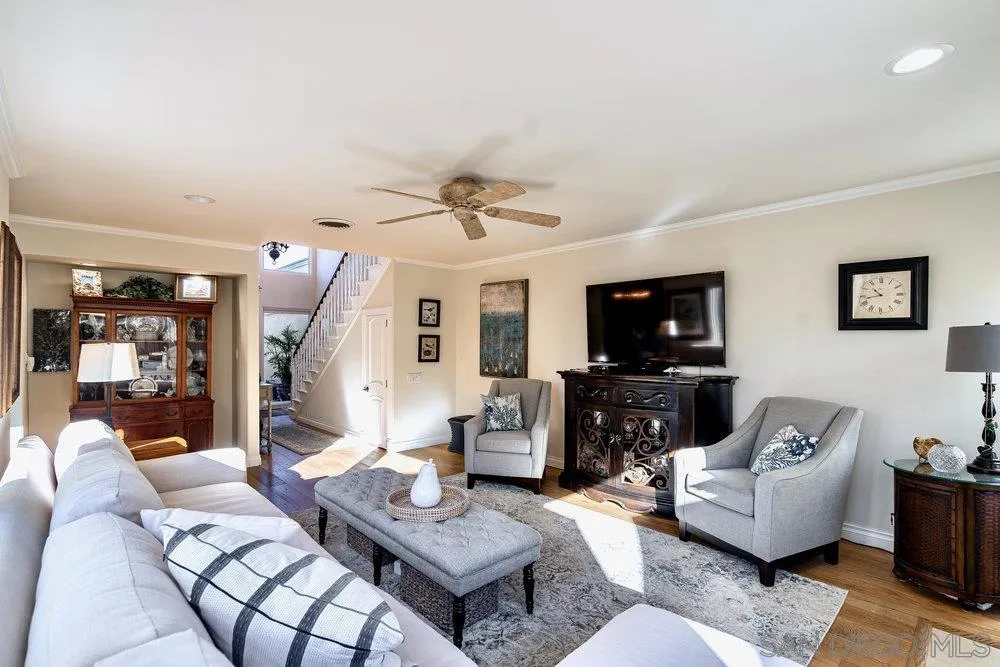 4 GingerTree Lane Coronado, CA 92118 - Photo 6 of 54 a living room with furniture a flat screen tv and a fireplace