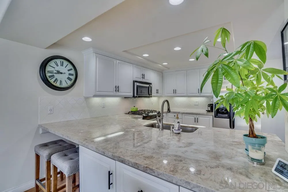 4 GingerTree Lane Coronado, CA 92118 - Photo 9 of 54 a living room with furniture and a clock