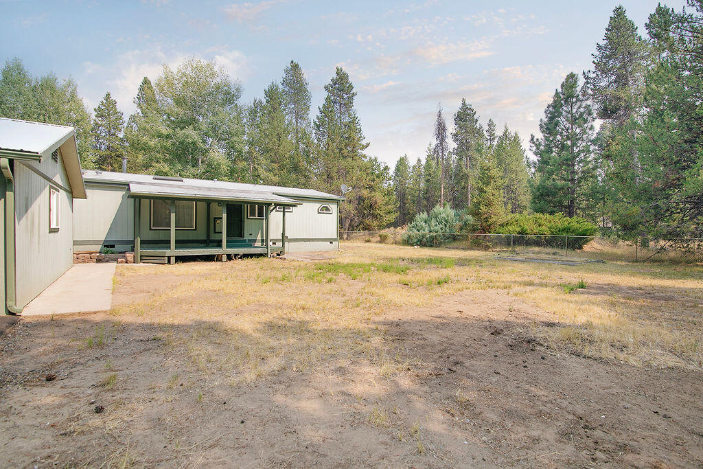 17231 Downey Road Bend, OR 97707 - Photo 32 of 40 a view of house with yard and trees in the background