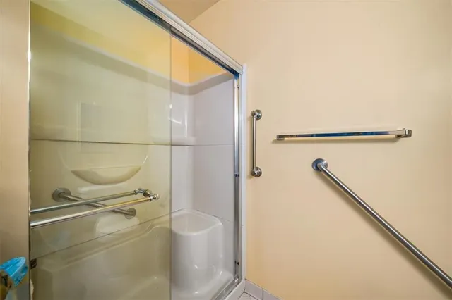 a bathroom with a shower and a toilet