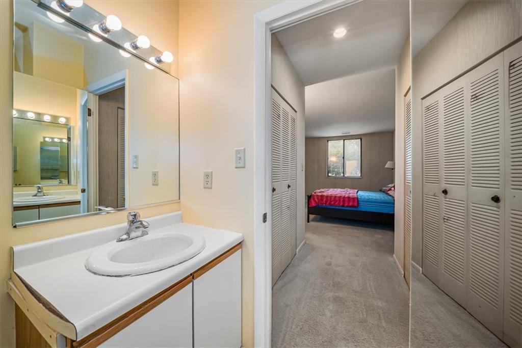 5715 Beacon Street, Unit 108 Pittsburgh, PA 15217 - Photo 18 of 27 a en suite bathroom with a sink and a mirror