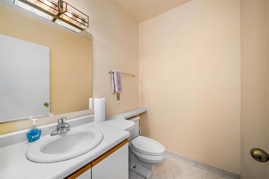 5715 Beacon Street, Unit 108 Pittsburgh, PA 15217 - Photo 20 of 27 a bathroom with a sink and a mirror