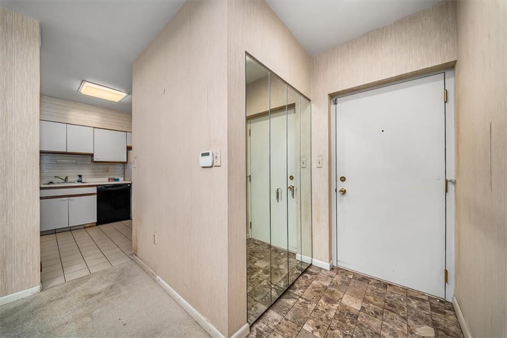 5715 Beacon Street, Unit 108 Pittsburgh, PA 15217 - Photo 5 of 27 a view of a kitchen from the hallway