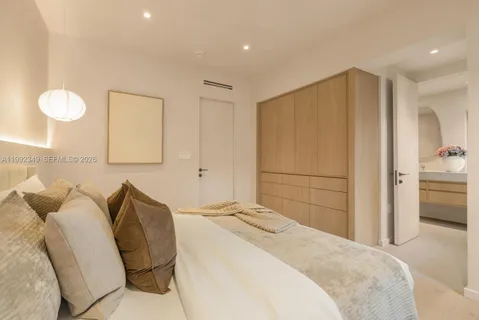 a view of a house with swimming pool and sitting area