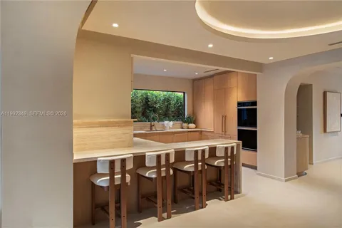 a spacious bedroom with a bed and a window