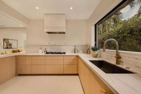 a bedroom with a large bed and a large window