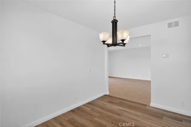 a view of a sink a window and a cabinets