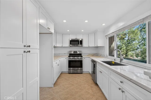 a view of a kitchen with a sink