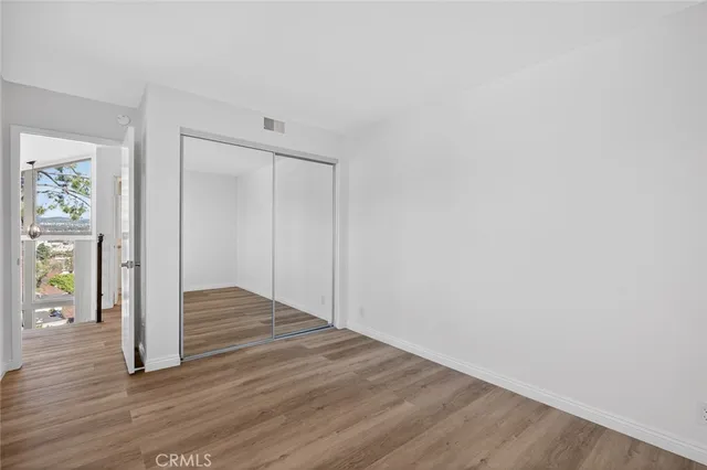 an aerial view of residential house with outdoor space and trees all around