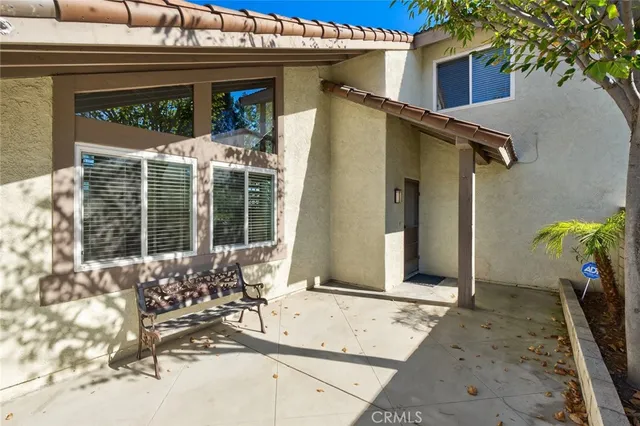 a view of an empty room with fireplace and a window