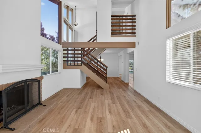 a view of an entryway with wooden floor