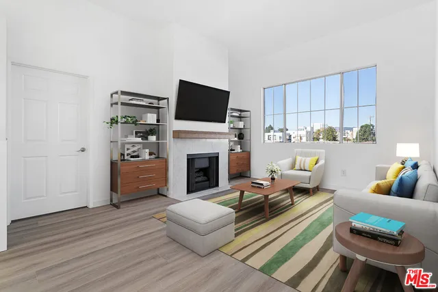 a living room with furniture fireplace and a flat screen tv