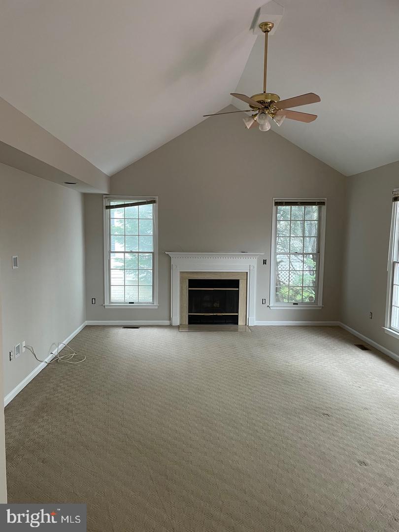 6404 Empty Song Road Columbia, MD 21044 - Photo 7 of 20 Family room with vaulted ceilings and Fireplace