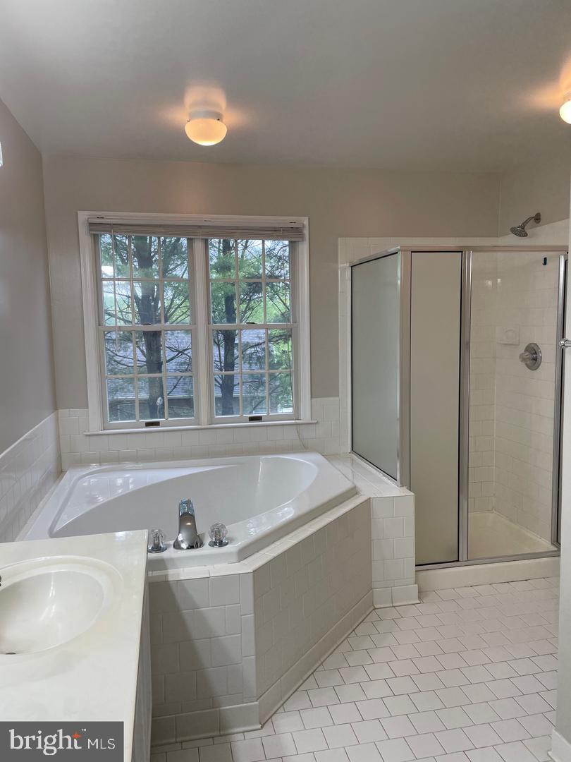 6404 Empty Song Road Columbia, MD 21044 - Photo 10 of 20 Serene bathroom with natural light.