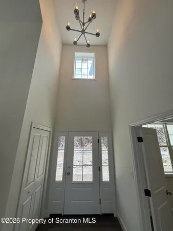 a room with wooden floors and window