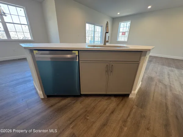 a white toilet sitting next to a window