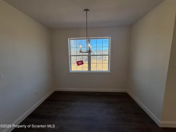 a room with a bench and wooden floor