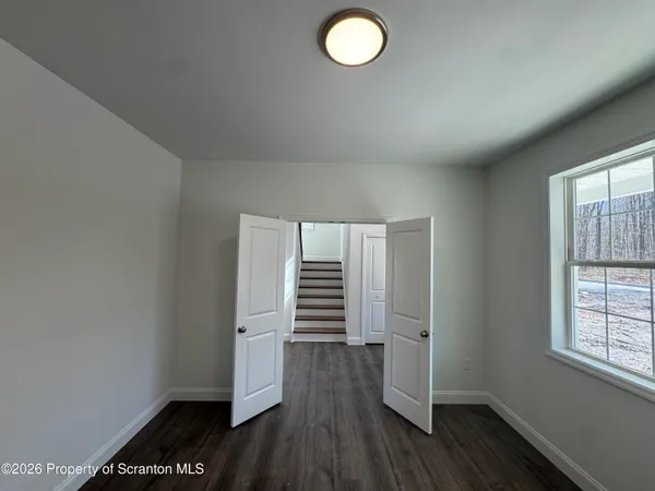 a view of an empty room with a window
