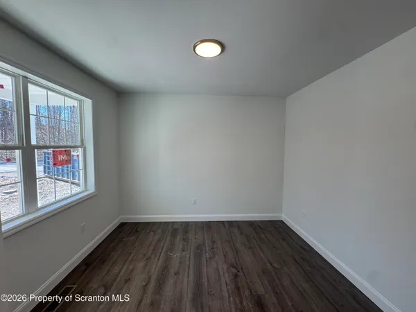 an empty room that has a window