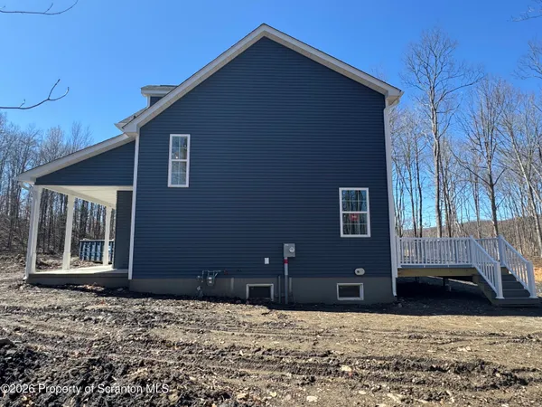 a view of balcony with wooden floor