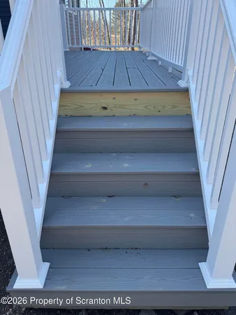 a view of a hallway with windows