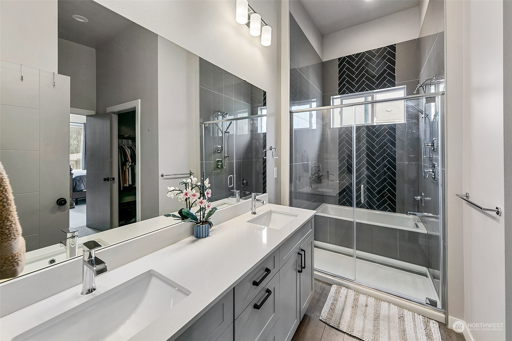 5136 South Creston Street Seattle, WA 98178 - Photo 14 of 27 a bathroom with a double vanity sink and mirror