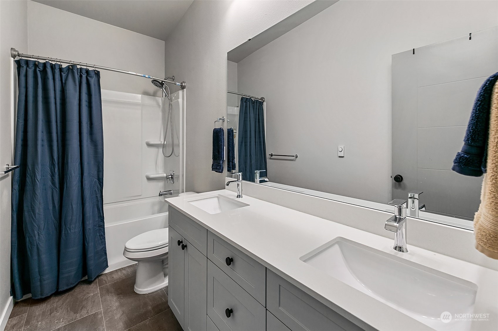 5136 South Creston Street Seattle, WA 98178 - Photo 18 of 27 a bathroom with a double vanity sink toilet and shower