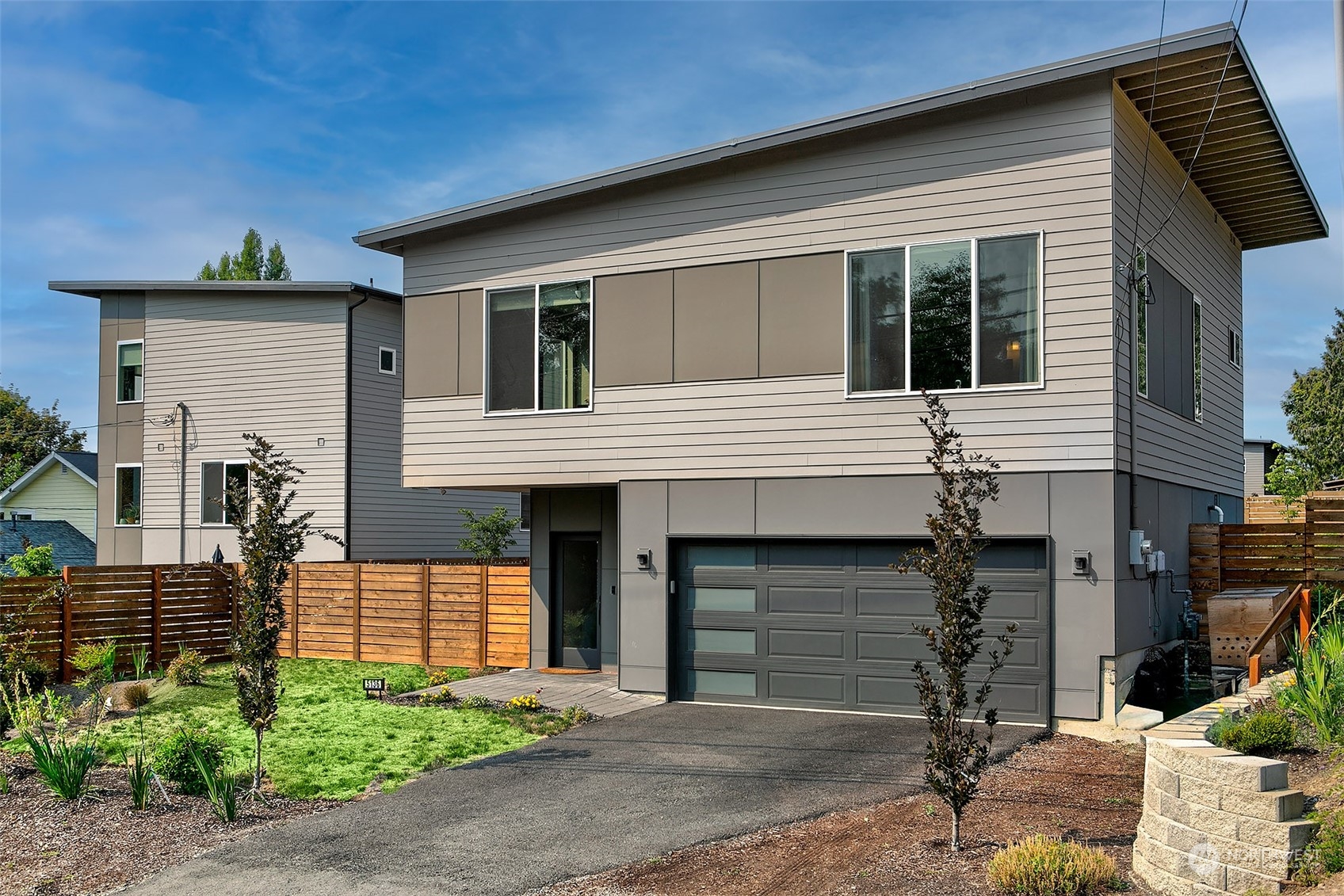 5136 South Creston Street Seattle, WA 98178 - Photo 3 of 27 a front view of a house with a yard