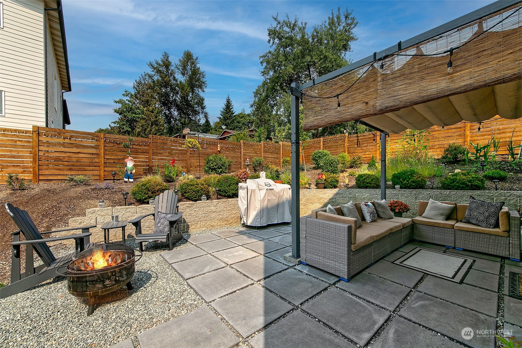 5136 South Creston Street Seattle, WA 98178 - Photo 7 of 27 an outdoor living room with patio furniture and a potted plants