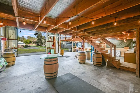 a view of a garage with wooden fence