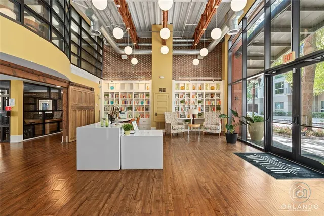 a lobby with furniture and floor to ceiling window