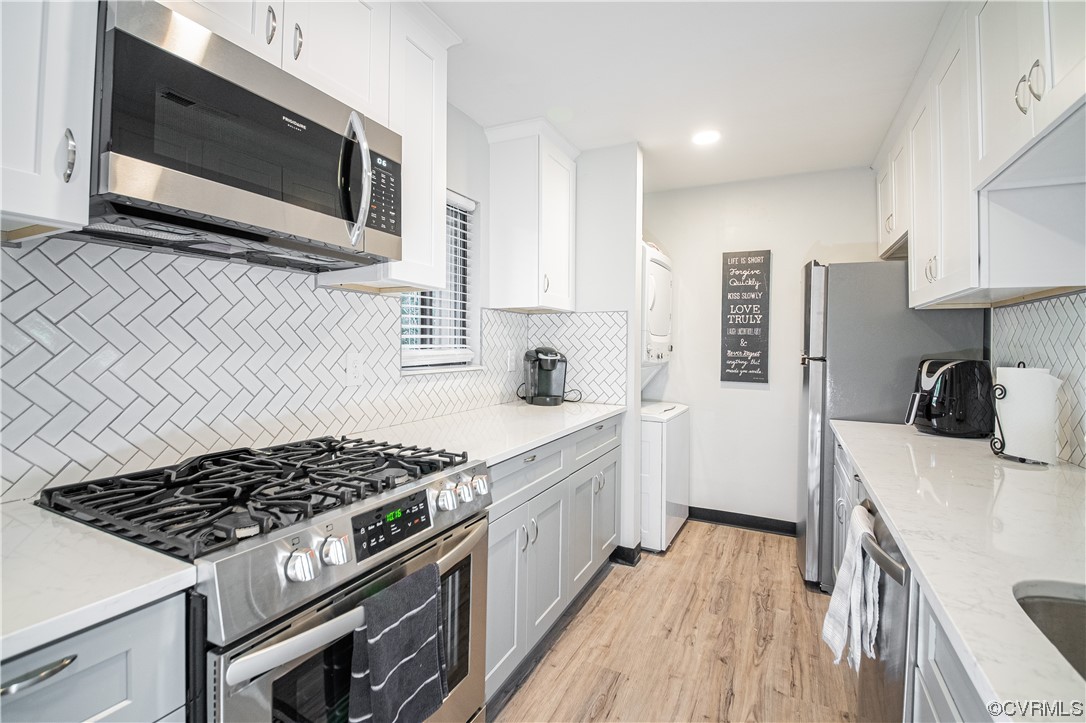 11601 East Briar Patch Drive Midlothian, VA 23113 - Photo 11 of 50 a kitchen with stainless steel appliances a sink a stove top oven a counter space and cabinets