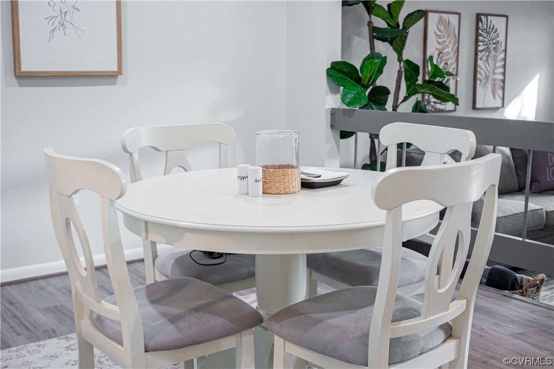 11601 East Briar Patch Drive Midlothian, VA 23113 - Photo 19 of 50 a view of a dining room with furniture and a potted plant