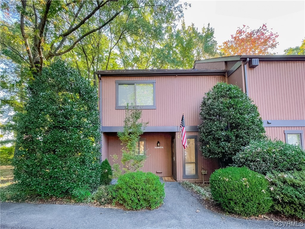 11601 East Briar Patch Drive Midlothian, VA 23113 - Photo 2 of 50 front view of a house with potted plants