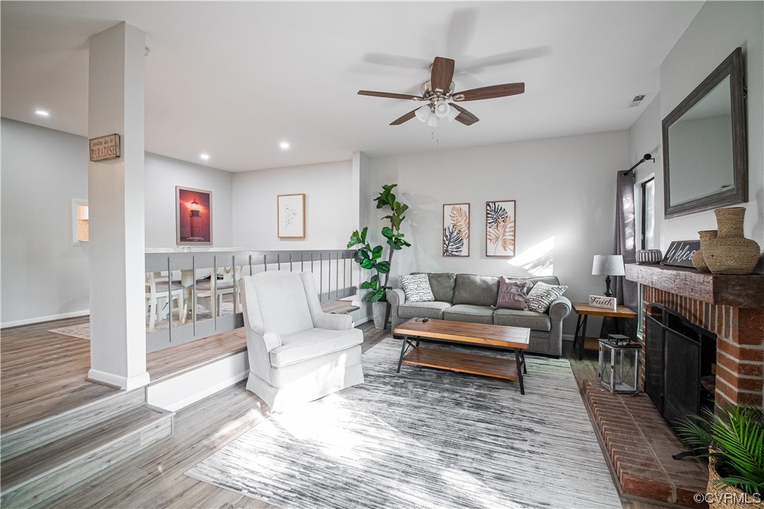 11601 East Briar Patch Drive Midlothian, VA 23113 - Photo 23 of 50 a living room with furniture and a wooden floor
